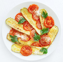 fried courgette and tomatoes with parmesan and parsley