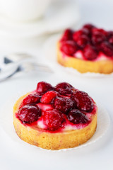 Tartlets with raspberries and a cup of tea