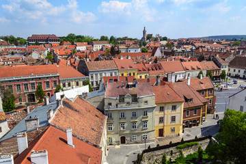 Fototapeta na wymiar Historical buildings of the old town seen from the Firewatch tower in Sopron, Hungary. Sopron skyline.