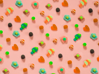Jelly candies pattern on pink background