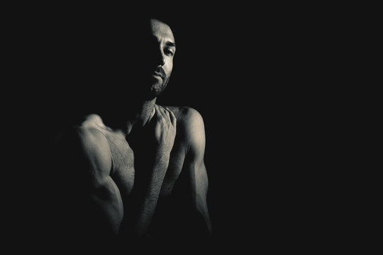 Muscular man looking at camera