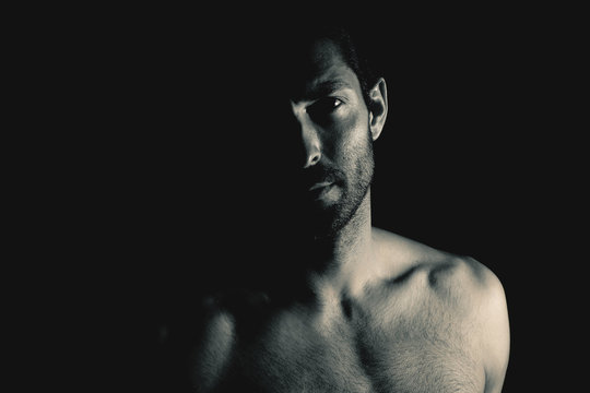 Muscular man looking at camera