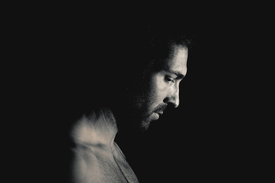 Muscular man looking down