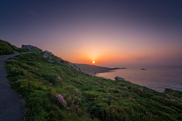 Fototapeta na wymiar Walking path along the Cornish coast at sunset