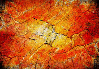 Art background, grunge concrete wall with cracks in orange color