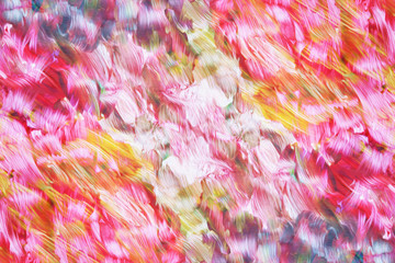 art abstract rainbow oil pattern background in pink, yellow and green colors in the shape of flowers