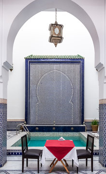 Courtyard decorated with mosaic and carvings in a Moroccan riad