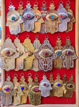 Handmade jewelry with Hamsa or Hand of Fatima at a market in Fes Morocco