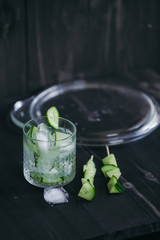 Homemade lime lemonade with cucumber. Cold beverage for hot summer day.