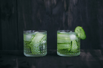 Homemade lime lemonade with cucumber. Cold beverage for hot summer day.