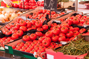 closeup of tomatoes piles at the market