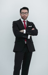 Portrait of businessman standing with arms crossed