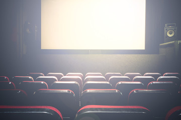 Movie Cinema hall with a white empty screen premiere with red seats