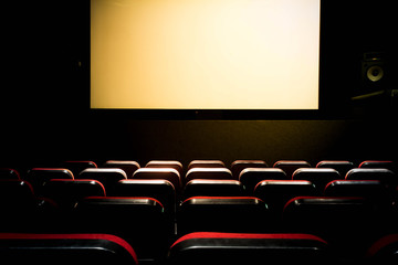 Movie Cinema hall with a white empty screen premiere with red seats