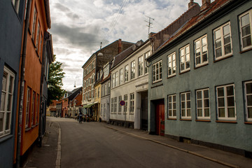 Fototapeta na wymiar Small city street in Denmark reflection windows