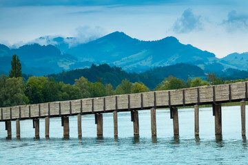The Holzsteg, a wooden pedestrian bridge crossing the Zurich Lake (Obersee) at its narrowest point  Part of the eastern branch of the Way of Saint James