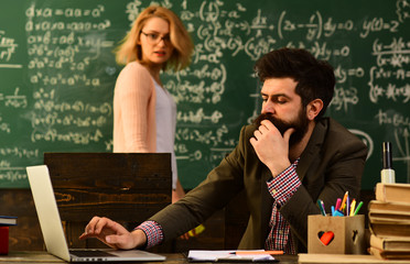 Portrait of female teacher using modern technology laptop in her class, Speaker at university meeting in the conference classroom, Professor and school student at the classroom in a school