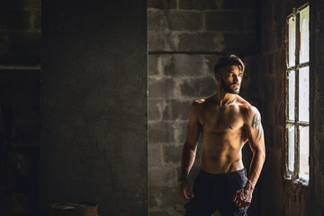  Man with muscular body and torso.