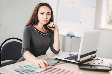 Graphic designer working with color palettes and graphic tablet in studio. Design, innovations, creative projects. Digital art, developing, media concept