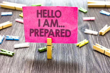 Writing note showing Hello I Am... Prepared. Business photo showcasing introduce yourself to someone as you are ready Multiple clips woody table small card clipped notice announcement.