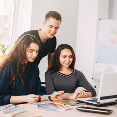 Designers team working with color palettes and graphic tablet in studio. Design, innovations, creative projects. Digital art, developing, media concept