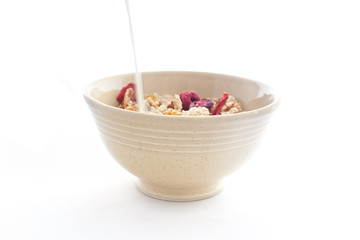 Bowl of cornflakes isolated on white