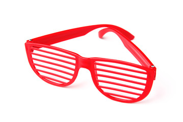 Red children's glasses for a party isolated on a white background