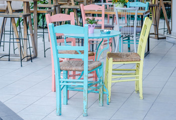 Fototapeta na wymiar Wooden chairs from open gardens in Leptokaria, Greece 