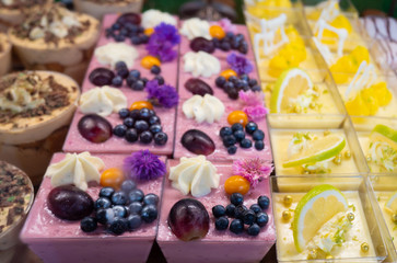 Assortment of delicious and colorful desserts made by pastry chef. All look very tasty and delightful. Natural light.