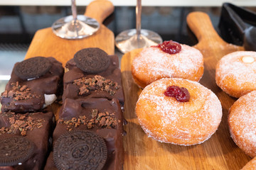 Assortment of delicious and colorful desserts made by pastry chef. All look very tasty and delightful. Natural light.
