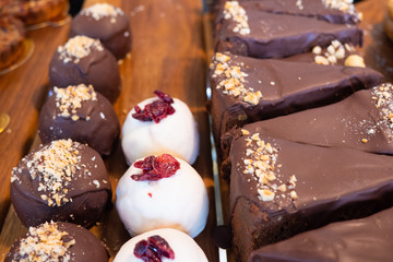 Assortment of delicious and colorful desserts made by pastry chef. All look very tasty and delightful. Natural light.
