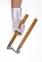 wooden nunchuck on white background