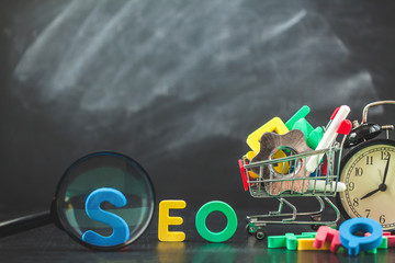 SEO Search engine optimization concept Colored letters of SEO with clock, magnifying , gears in a...