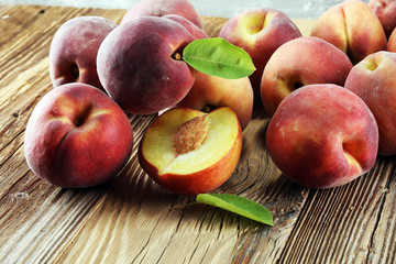 A group of ripe peaches on table