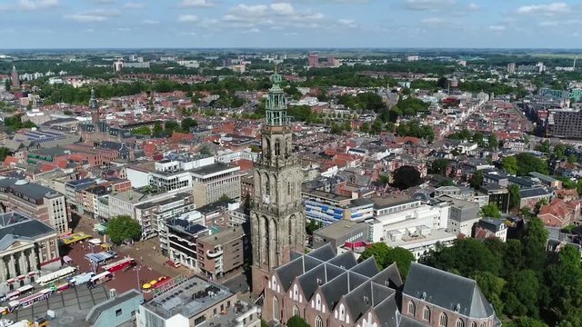 Aerial footage of Martinitoren the highest church steeple in city of Groningen Netherlands and bell tower of Martinikerk it is located at the north-eastern corner of the Grote Markt Main Market Square