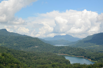 Mountain landscape in a green valley with the villages. View of Kotmale Reservoir, Sri Lanka.