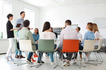 Young people having business training in office