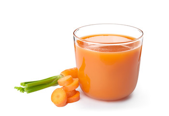 Glass with carrot juice and fresh vegetable on white background
