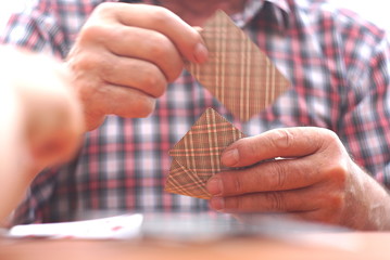 Elderly Man With Playing Cards