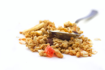Breakfast concept : muesli with spoon isolated on white