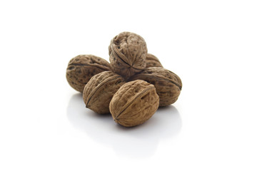Stack of walnuts isolated on white