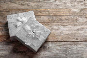 Beautiful gift boxes on wooden background
