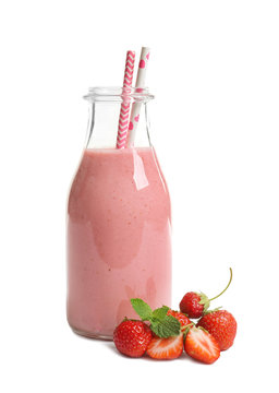 Bottle with tasty strawberry smoothie on white background