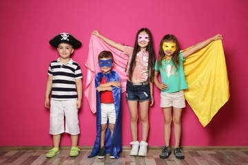 Naklejka premium Playful little children in cute costumes indoors
