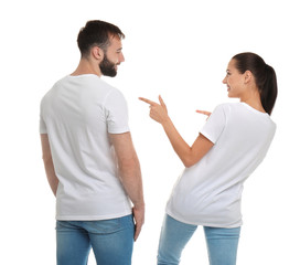 Young couple in t-shirts on white background. Mockup for design