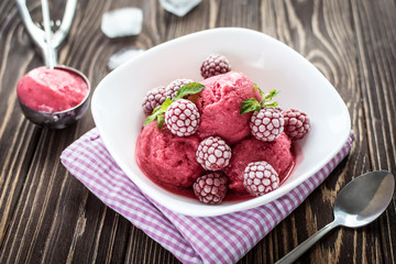 Delicious ice cream  made from fresh berries on a wooden background