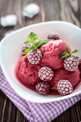 Delicious ice cream  made from fresh berries on a wooden background