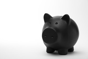 Black piggy bank on white background. Money saving