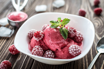 Delicious ice cream  made from fresh berries on a wooden background - obrazy, fototapety, plakaty