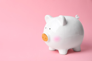 White piggy bank on color background. Money saving